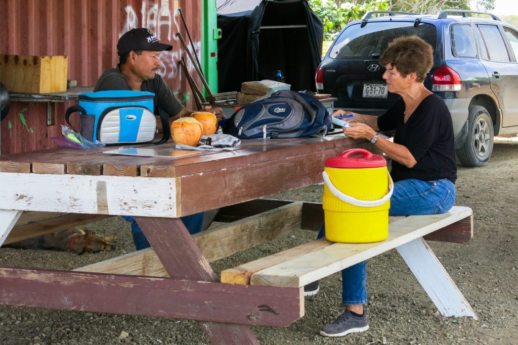 two people sitting opposite each other and talking
