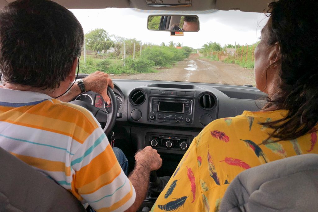 two people sitting side by side in the car